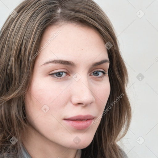 Neutral white young-adult female with long  brown hair and blue eyes