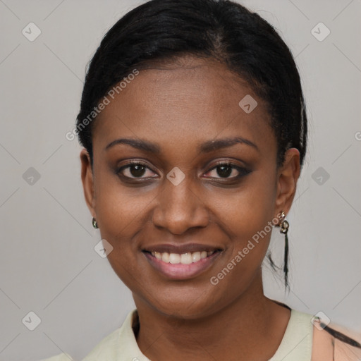 Joyful black young-adult female with short  black hair and brown eyes