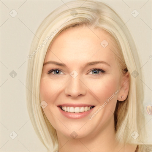 Joyful white young-adult female with long  brown hair and blue eyes