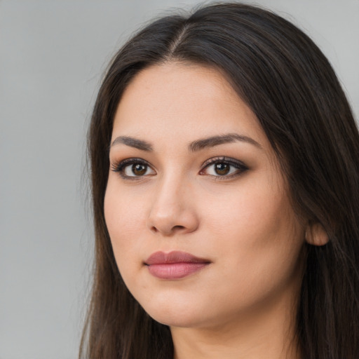 Neutral white young-adult female with long  brown hair and brown eyes