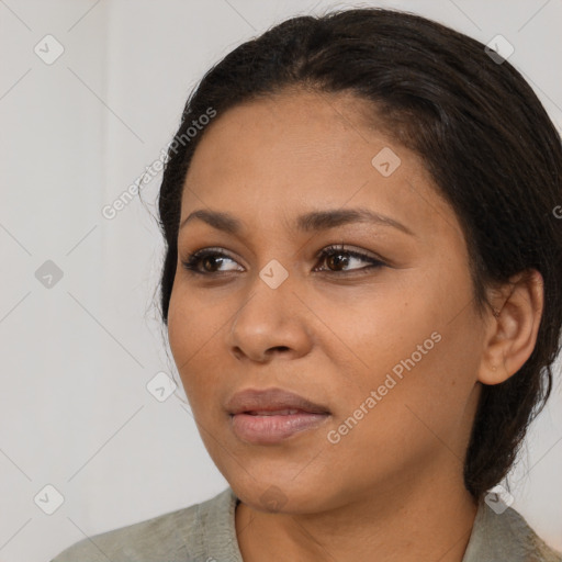 Neutral black young-adult female with medium  black hair and brown eyes