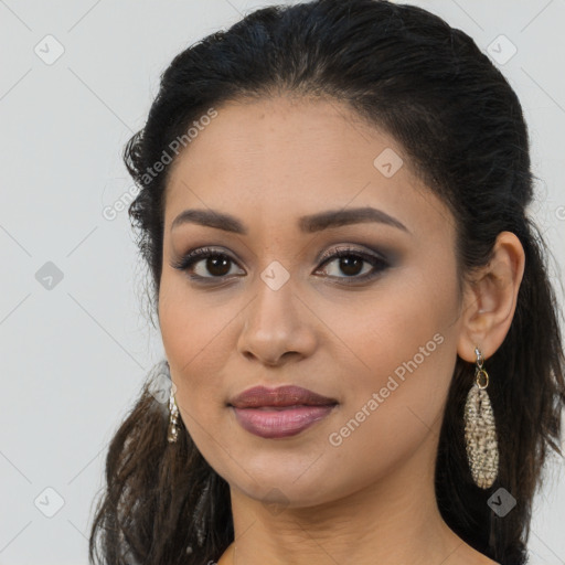 Joyful latino young-adult female with long  brown hair and brown eyes