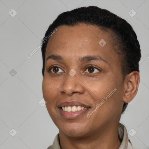 Joyful black young-adult female with short  brown hair and brown eyes