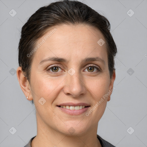 Joyful white adult female with short  brown hair and brown eyes