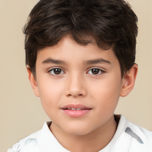 Joyful white child male with short  brown hair and brown eyes