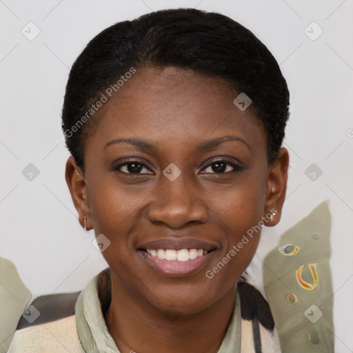 Joyful black young-adult female with short  brown hair and brown eyes