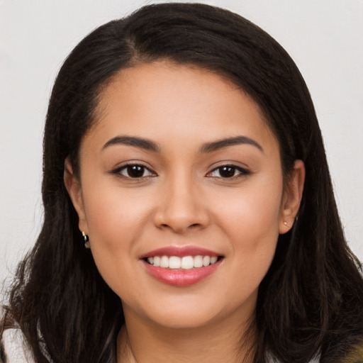 Joyful white young-adult female with long  brown hair and brown eyes