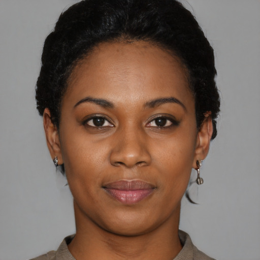Joyful latino young-adult female with short  black hair and brown eyes