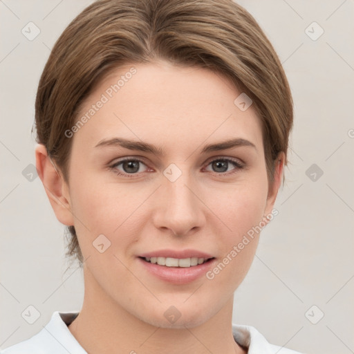 Joyful white young-adult female with short  brown hair and grey eyes