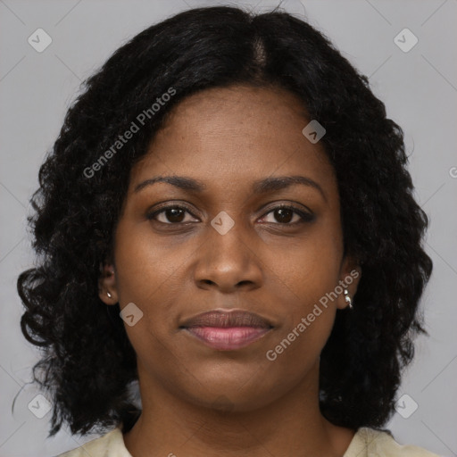 Joyful black young-adult female with medium  brown hair and brown eyes