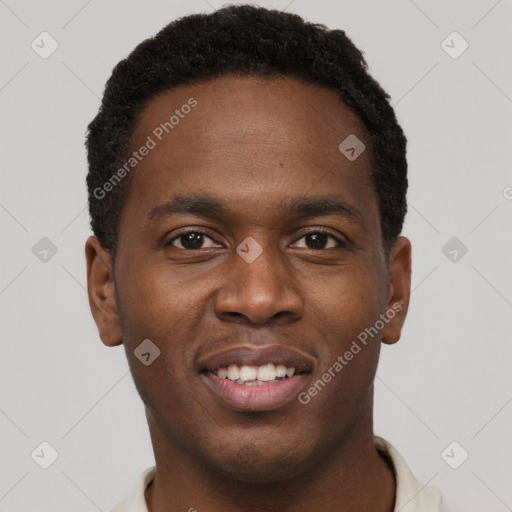 Joyful black young-adult male with short  brown hair and brown eyes