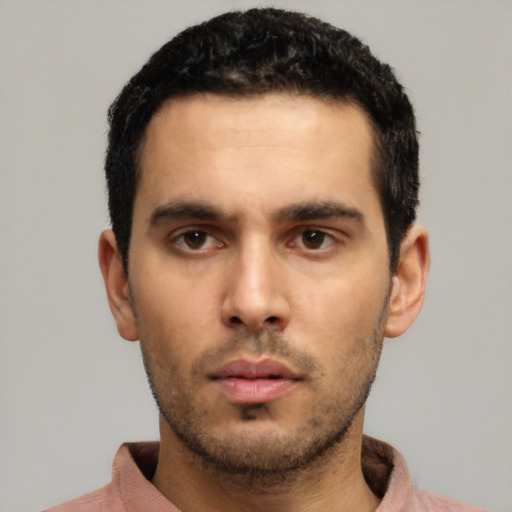 Neutral white young-adult male with short  black hair and brown eyes