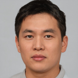 Neutral asian young-adult male with short  brown hair and brown eyes