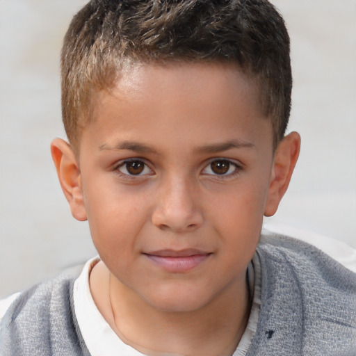 Joyful white child male with short  brown hair and brown eyes