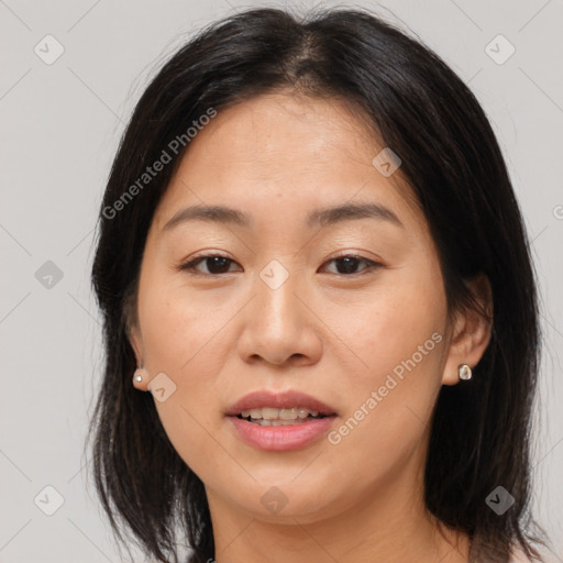 Joyful asian young-adult female with medium  brown hair and brown eyes