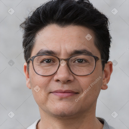 Joyful white adult male with short  brown hair and brown eyes