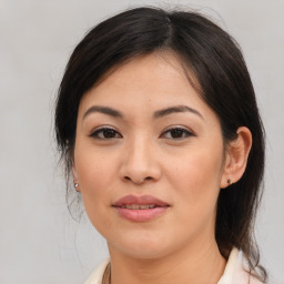 Joyful asian young-adult female with medium  brown hair and brown eyes