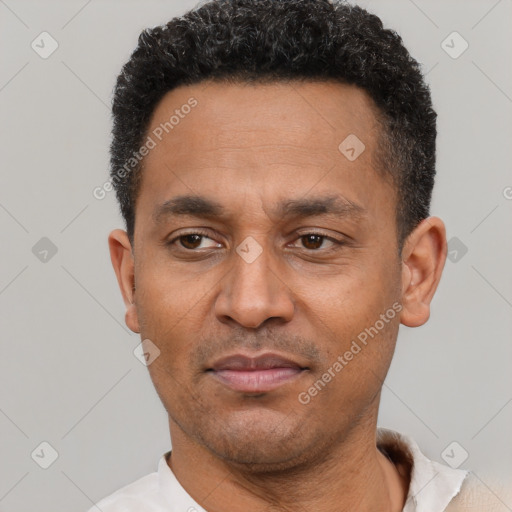 Neutral latino adult male with short  black hair and brown eyes