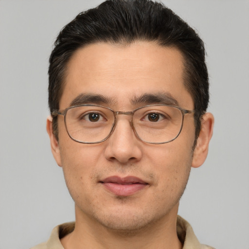 Joyful white adult male with short  brown hair and brown eyes