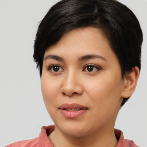 Joyful latino young-adult female with medium  black hair and brown eyes