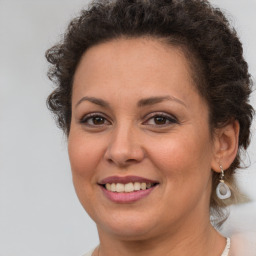 Joyful white adult female with short  brown hair and brown eyes