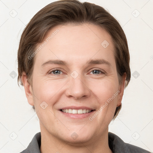 Joyful white adult female with short  brown hair and grey eyes