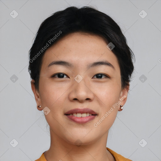 Joyful asian young-adult female with short  black hair and brown eyes