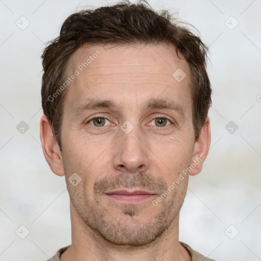 Joyful white adult male with short  brown hair and grey eyes