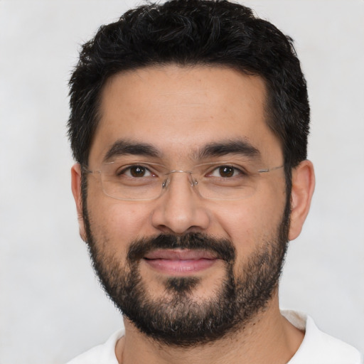 Joyful asian young-adult male with short  black hair and brown eyes