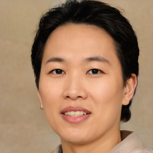 Joyful asian young-adult female with medium  brown hair and brown eyes