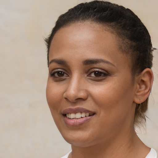 Joyful white young-adult female with short  brown hair and brown eyes