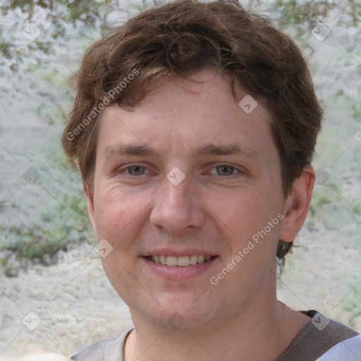 Joyful white adult male with short  brown hair and grey eyes