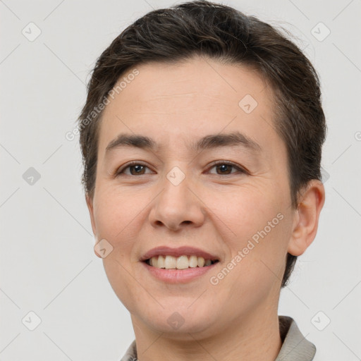 Joyful white young-adult female with short  brown hair and brown eyes