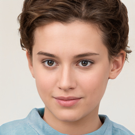 Joyful white child female with short  brown hair and brown eyes