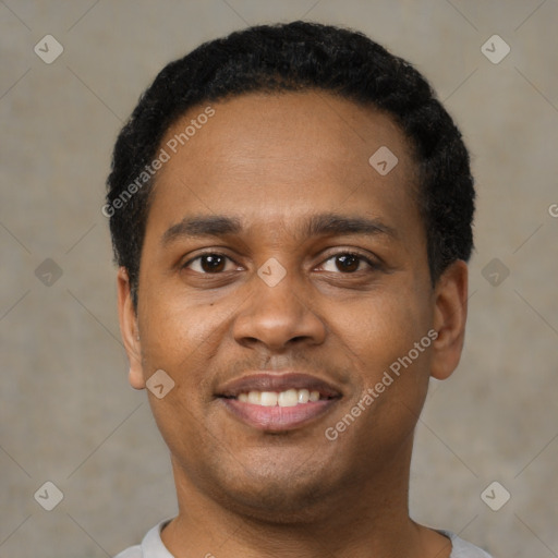 Joyful black young-adult male with short  black hair and brown eyes