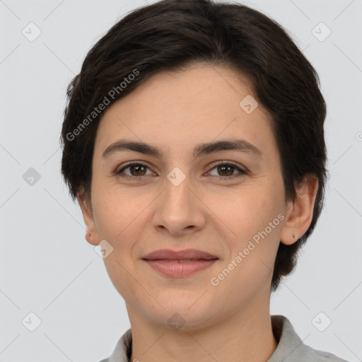 Joyful white young-adult female with short  brown hair and brown eyes