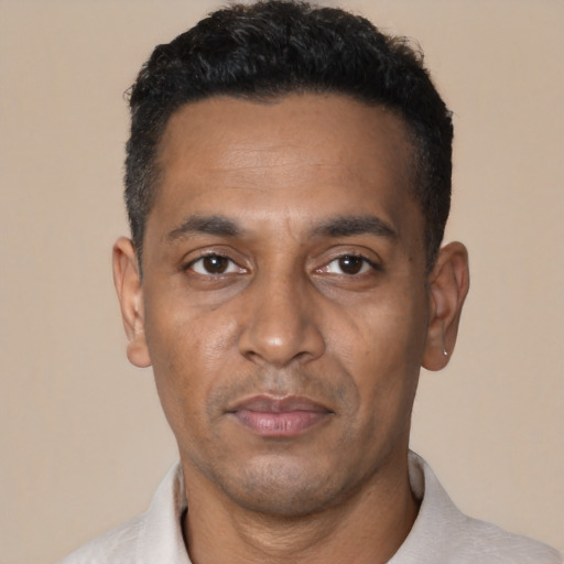 Neutral black adult male with short  black hair and brown eyes