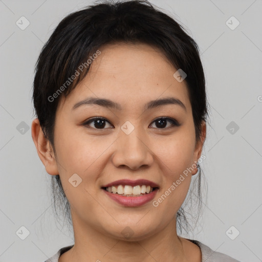 Joyful asian young-adult female with medium  black hair and brown eyes