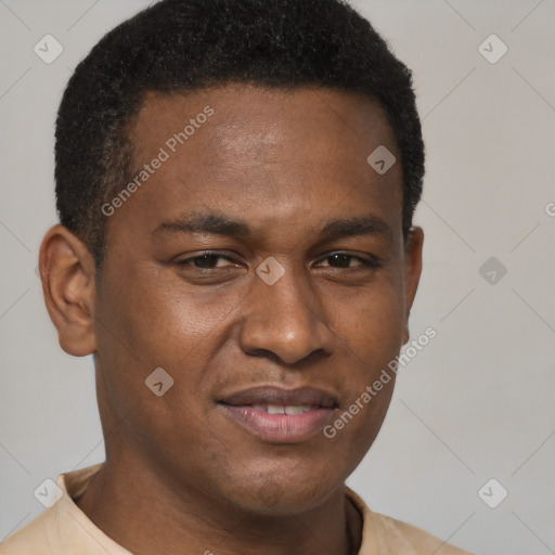 Joyful black young-adult male with short  brown hair and brown eyes