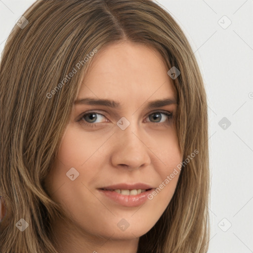 Joyful white young-adult female with long  brown hair and green eyes