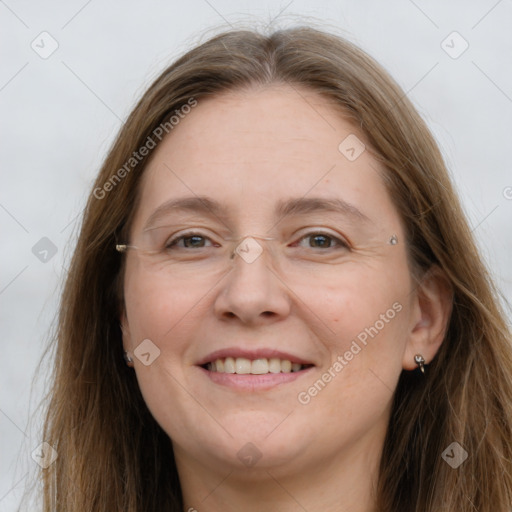 Joyful white adult female with long  brown hair and grey eyes