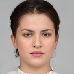 Neutral white young-adult female with medium  brown hair and brown eyes