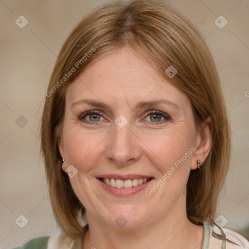 Joyful white adult female with medium  brown hair and blue eyes