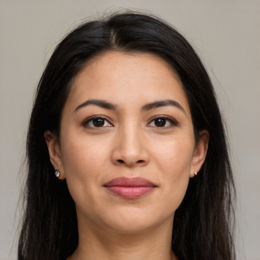 Joyful latino young-adult female with long  brown hair and brown eyes