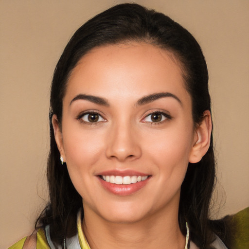 Joyful white young-adult female with long  black hair and brown eyes