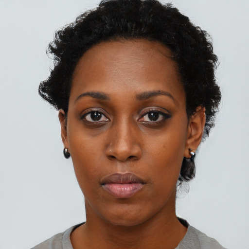 Neutral black young-adult female with short  black hair and brown eyes