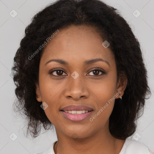 Joyful black young-adult female with long  brown hair and brown eyes