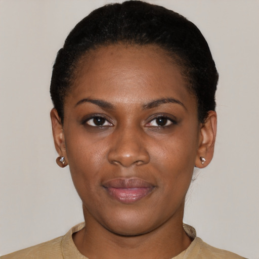 Joyful latino young-adult female with short  black hair and brown eyes