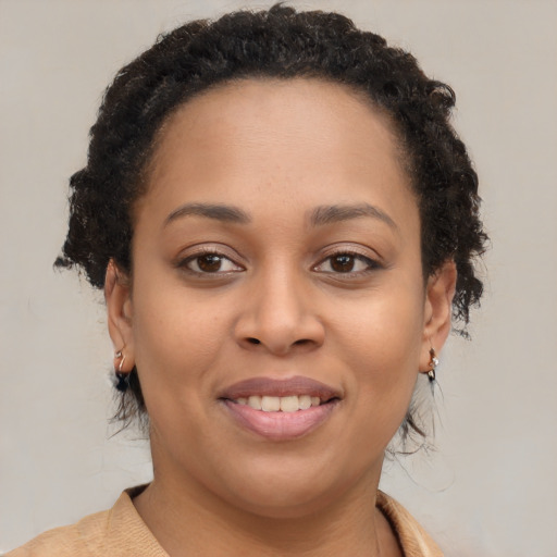 Joyful black young-adult female with medium  brown hair and brown eyes