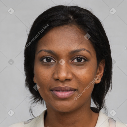 Joyful black young-adult female with medium  brown hair and brown eyes